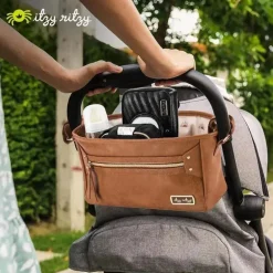 Itzy Ritzy - Caddy de carrinho de viagem de conhaque