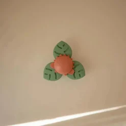 Mushie - brinquedo giratório de sucção Dino para banho e brincadeira