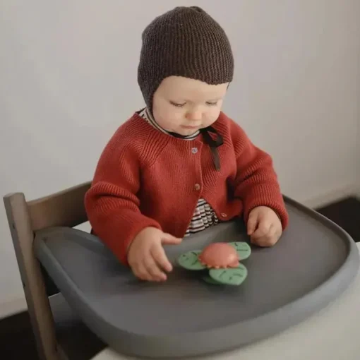 Mushie - brinquedo giratório de sucção Dino para banho e brincadeira