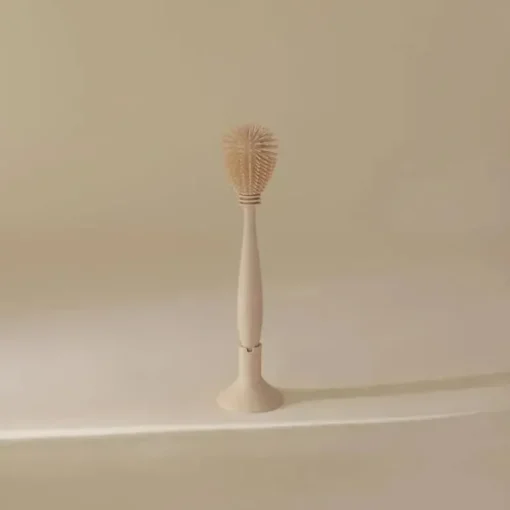 Mushie - Escova para mamadeira, silicone macio com base de sucção, areia móvel