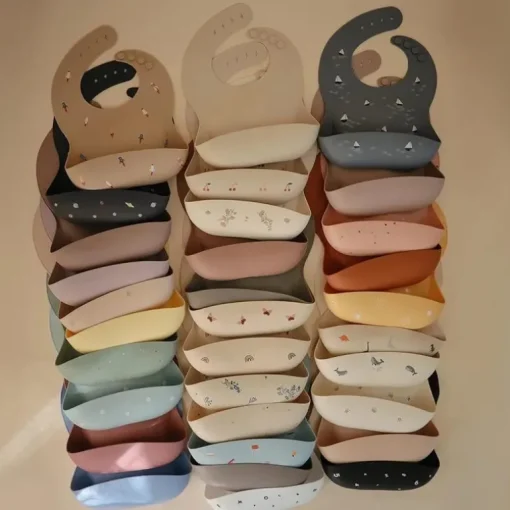Mushie - Silicone Baby Bib, Dinosaurs