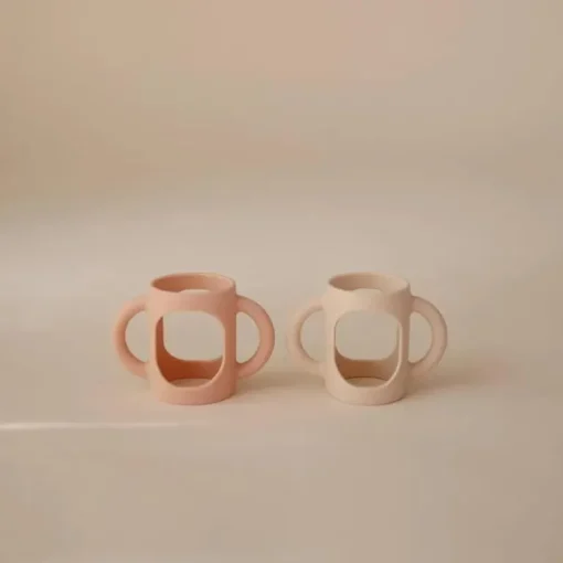Mushie - Silicone Bottles Handles, Blush/Shifting Sand