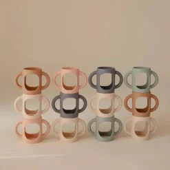 Mushie - Silicone Bottles Handles, Blush/Shifting Sand